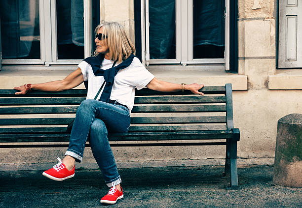 Female watching the world at Chinon, France by the Indre.