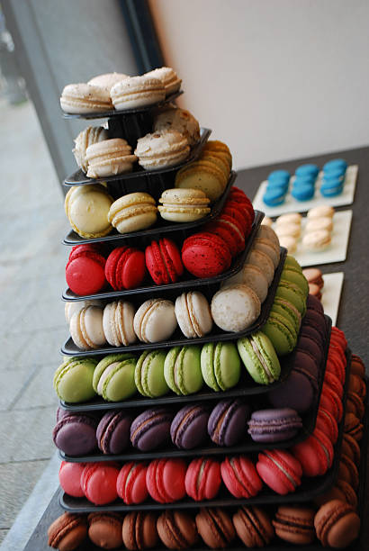 istock Colorful Macaron Tower Displayed in Patisserie Window 2243651529