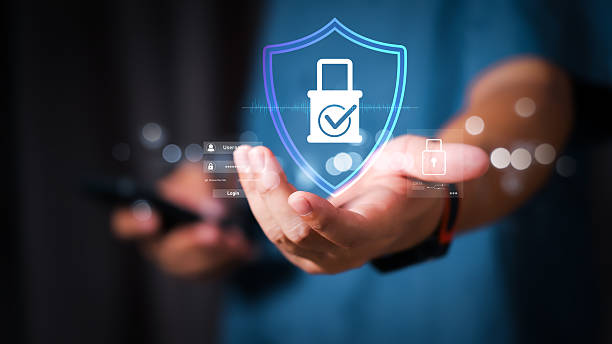 istock Businessman holding a digital shield with lock icon, representing cybersecurity, data protection, secure access, privacy, and digital safety in modern technology and online business. 2243655566