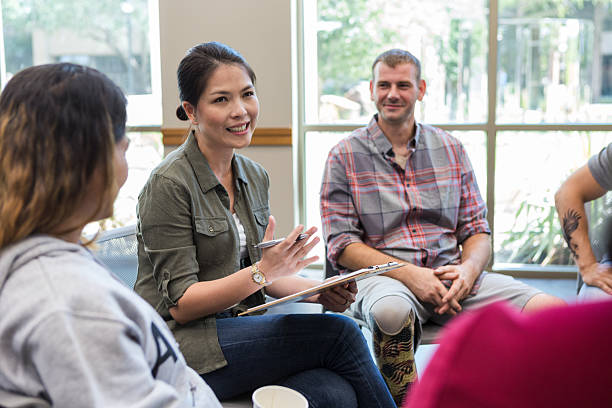 istock People in a supportive group therapy session discussing their experiences and emotions 2243660509