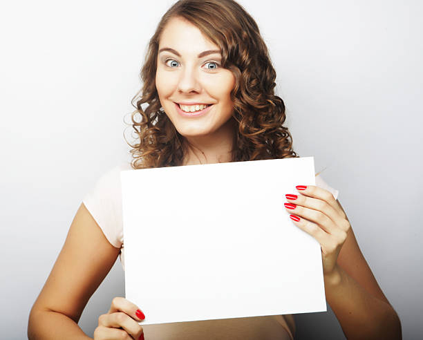 istock Woman holding blank card 2243660800