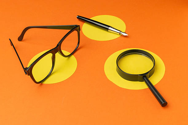 Eyeglasses on table with computer