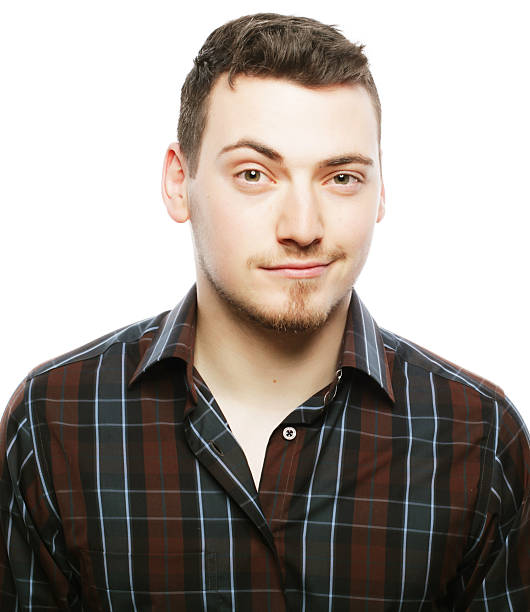 istock Handsome young man in shirt looking at camera 2243661115