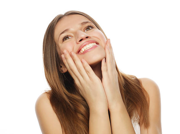 istock Attractive young woman smile and looking up 2243661179