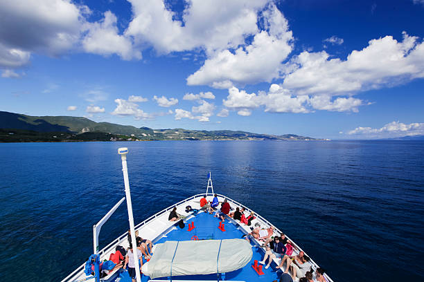 SEA, GREECE - May 15, 2014: tourists on the top deck of ship sailing from Zakynthos island. people (big group) on the deck of a ship, Greece