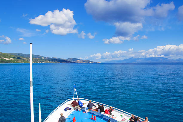 SEA, GREECE - May 15, 2014: tourists on the top deck of ship sailing from Zakynthos island. people (big group) on the deck of a ship, Greece