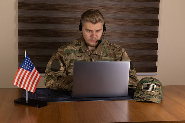 istock A soldier is working on a laptop at a desk 2243662618