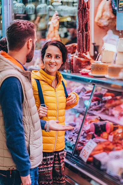 Couple shopping at Valencia Farmers Market before Christmas