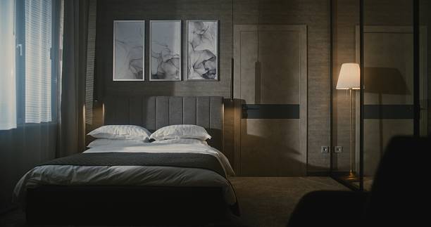 istock Elegant Mature Hotel Manager in Formal Suit Inspects Luxury Hotel Room 2243665310