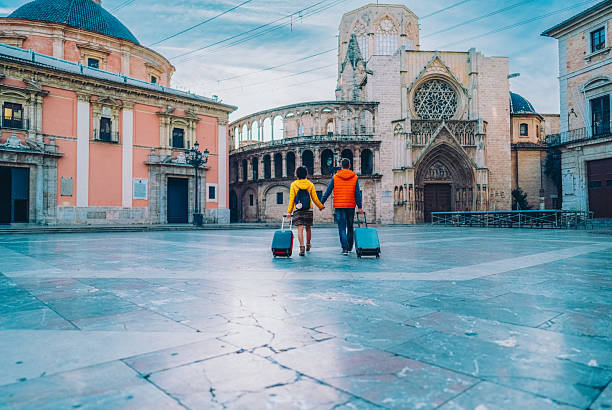 istock Couple walking with luggage in Valencia’s historic centre 2243666026