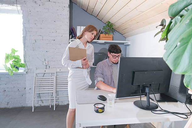 istock couple working in the office or from home 2243666419