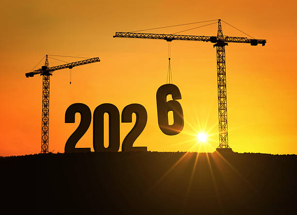 istock Silhouette of cranes building the number 2026 at sunset, symbolizing progress, construction, and the beginning of a new year filled with hope, growth, and opportunities for the future. 2026, creative 2243667889