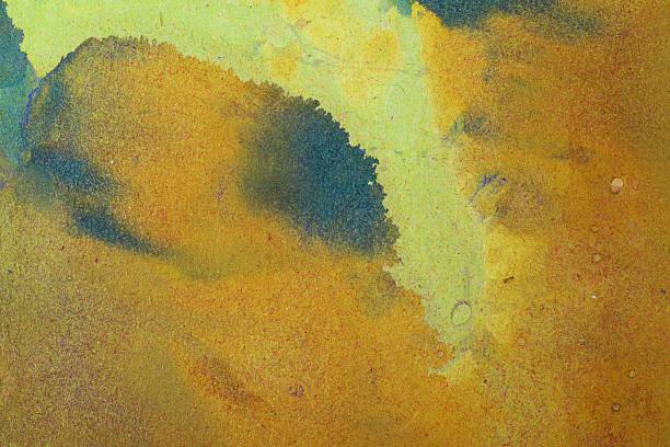 istock Mottled bronze, gold, indigo, mx waterpaint background texture on rough paper 2243668928