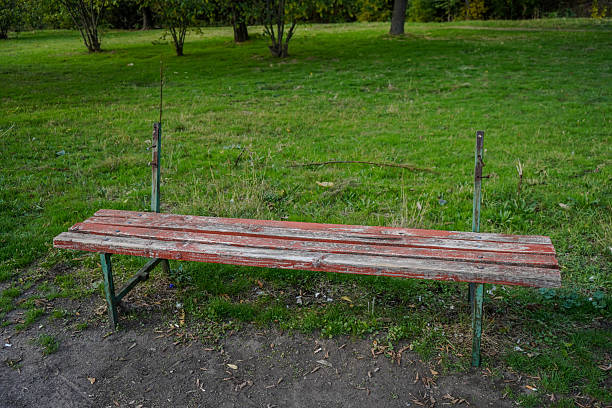 Old weathered wooden bench in a quiet park