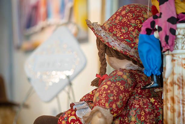 A charming display of vintage dolls showcasing colorful clothing and intricate details, evoking nostalgia and capturing the essence of childhood memories.