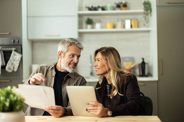 istock Mature couple discussing finances, planning home budget 2243673746