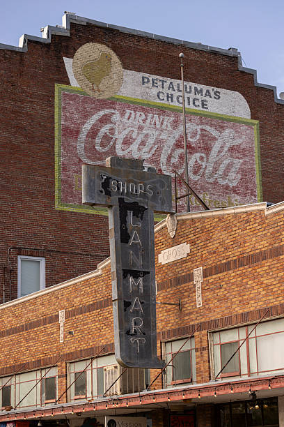Vincennes, Indiana - USA, May 14, 2025. Old Americana retail shop sign painted but faded on brick wall in Vincennes Indiana. Along the banks of the Wabash river, Vincennes is the oldest continually inhabited European settlement in Indiana and was its longest serving territorial capitals.