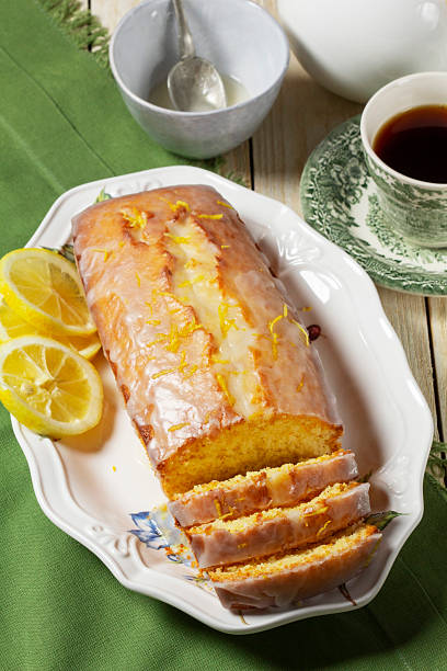 istock Aromatic lemon cake, covered with sugar icing and sprinkled with zest, served with tea. 2243675356