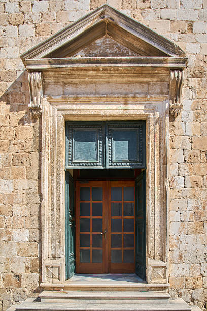 istock Classic stone portal with a modern entrance set inside 2243675888