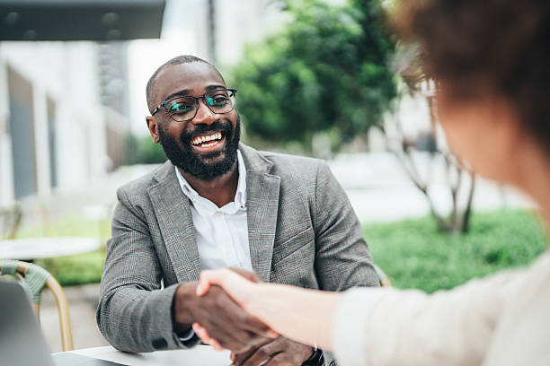 istock Successful business agreement sealed with a handshake in cafe 2243675963