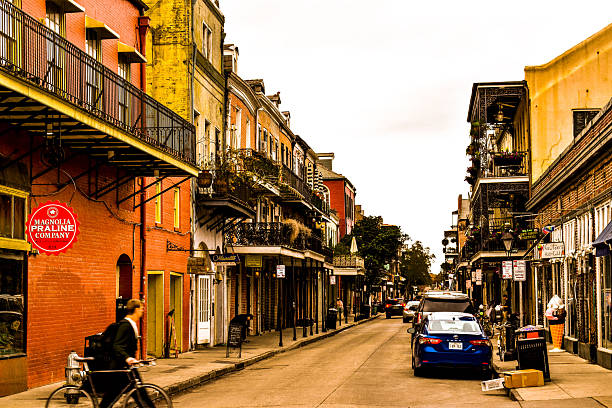 Colorfull Dumaine street, New Orleans. Colorfull Dumaine street at French quarter during busy hour, life in New Orleans, beautiful old architecture reflecting the multicultural heritage of the city