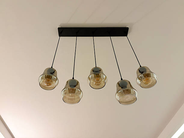 istock Lighting decor. Retro style chandelier hanging on the ceiling 2243678822