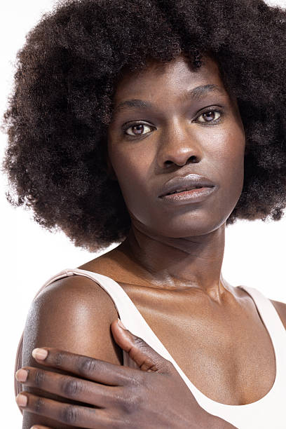 istock Beautiful young black woman posing against a white background 2243680990