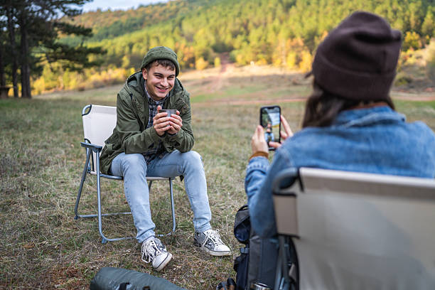 istock Young man posing for smart phone in natural environment 2243681351