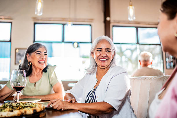 istock Senior friends women talking at restaurant 2243681801