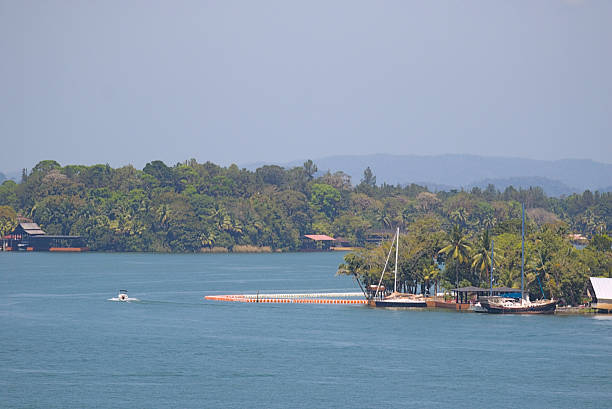 istock Small boats sailing under the bright Guatemalan sky 2243689847