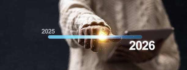 istock Female hand with tablet slides the loading bar from 2025 to 2026 on a virtual screen. Happy New Year concept or Celebration 2243689937