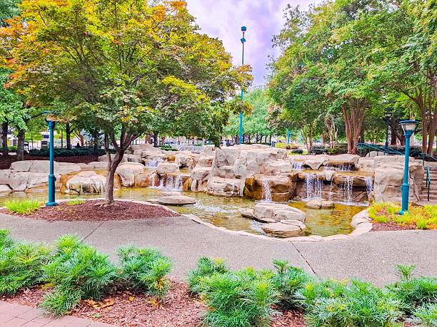 Water cascade at the Centennial Olympic Park in Atlanta, Georgia, USA. The Water Cascade was built for the 1996 Summer Olympic Games, made with boulders and rocks from area riverbeds. Today, the 20 acre park serves a dual purpose: It serves as Georgia's lasting memorial to the 1996 Olympic Games the centennial of the Summer Olympic Games also known as the XXVI Olympiad and is a highly visible symbol of efforts to revitalize residential and commercial development in Georgia's capital city, Atlanta.