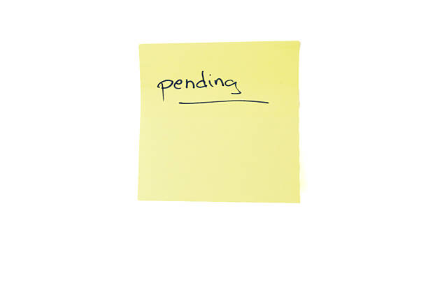 blank orange adhesive note on pink color background