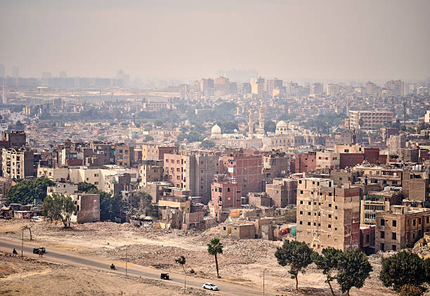 istock Panoramic aerial view over Cairo, Egypt, showcasing urban architecture and historic landmarks under hazy sunlight 2243694472