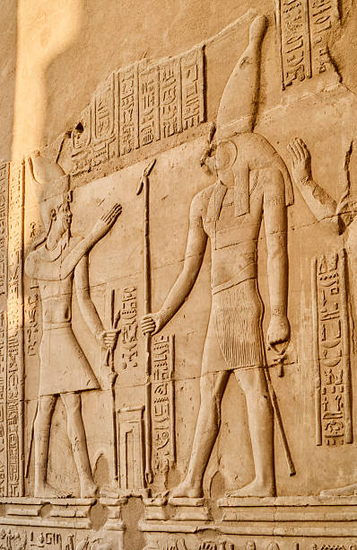 istock Historic Egyptian wall relief depicting ancient deities discovered in an archaeological site 2243694517