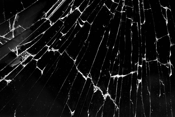 istock cracked glass isolated in black background 2243696395