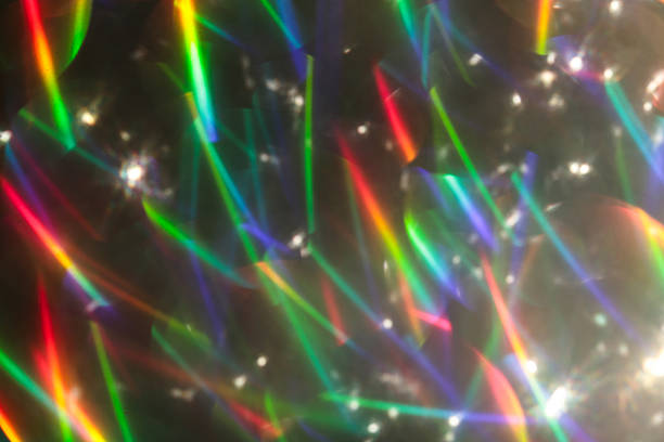 istock Colorful glitter rainbow glow light flare sparks abstract overlay texture 2243696513