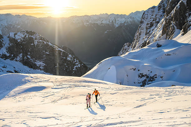 istock Two Skiers on a Snowy Mountain Slope 2243696944