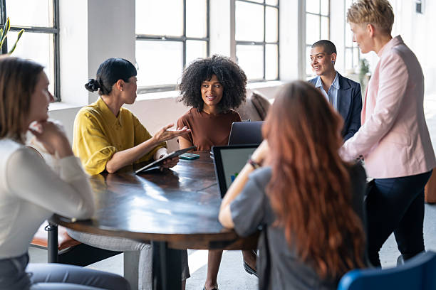 istock Group of businesswomen collaborating on project in modern office 2243697498