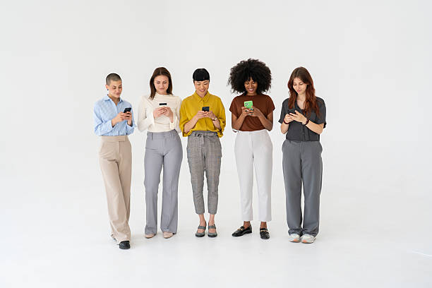 istock Businesswomen using smartphones in a modern office 2243697506