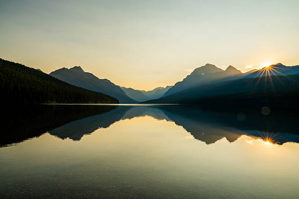 istock Bright Sun Burst Over A Mostly Still Bowman Lake In Summer 2243697720