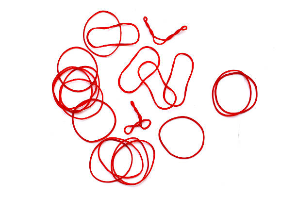 istock Close-up of circular red rubber bands. 2243699119