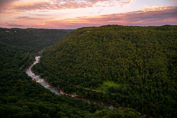 istock Pink Sunset Light Over New River from the Endless Wall Trail 2243699792