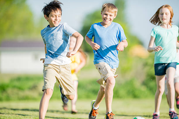 istock Happy Kids Running Outdoors Together During Playtime On A Sunny Day 2243703888