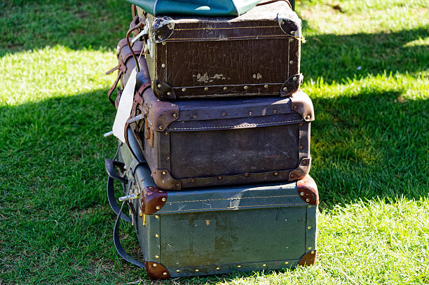 Suitcases for sale, three suitcases piled up await a buyer