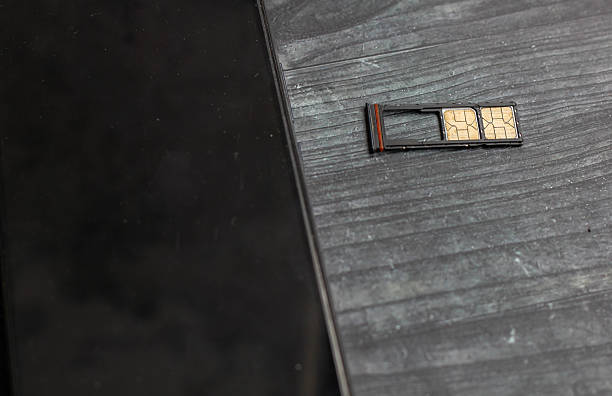 istock dual nano SIM card smartphone installed doing card change isolated black board background 2243711317