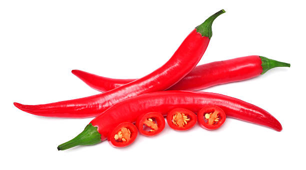 istock Red chili pepper cut into slices isolated on white background 2243715347