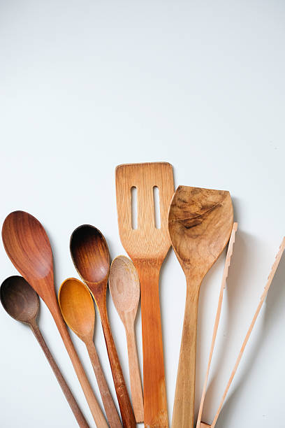 istock Wooden kitchen utensils isolated on white background 2243715838