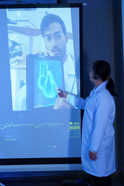 istock Doctors and nurses are discussing and analyzing a patient's heart disease via video conference in a conference room. 2243716777