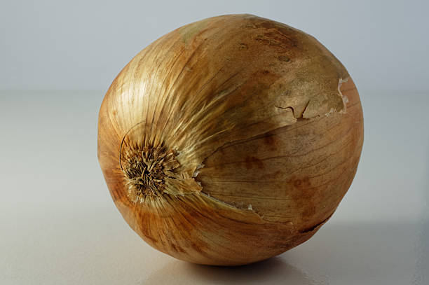 Raw Yellow Onions in Old Pan Overhead